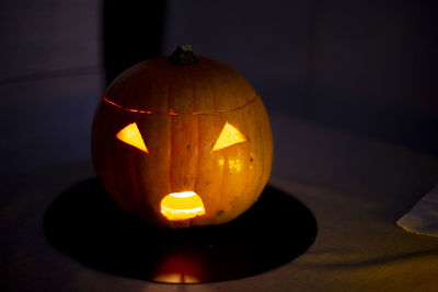 Close-up of illuminated pumpkin on table