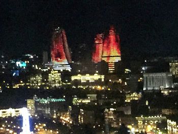 Illuminated cityscape at night