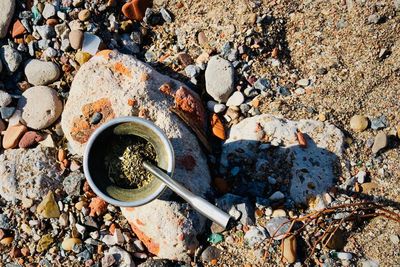 High angle view of mate tea on rock