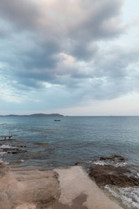 Scenic view of sea against cloudy sky