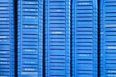 Full frame shot of blue plastic tables