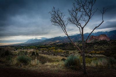 Scenic view of mountains against cloudy sky