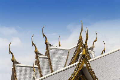 Part of the beautiful temple roof in thailand. wat sothon wararam worawihan with blue sky.