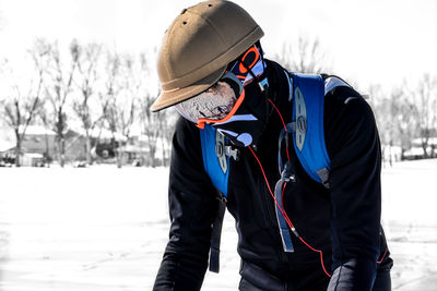 Midsection of person standing in snow