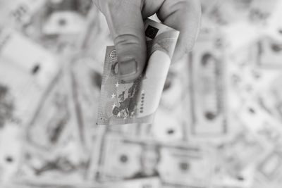 Cropped hand of woman holding key