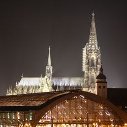 Illuminated cologne cathedral against clear sky at night