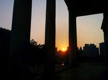 Silhouette of city at sunset