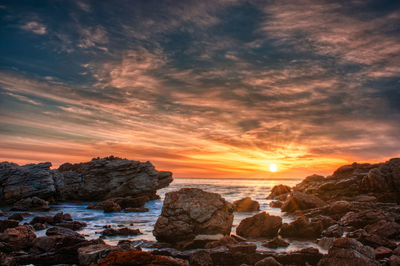 Scenic view of sea against sky during sunset