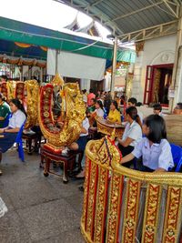 People standing at market stall