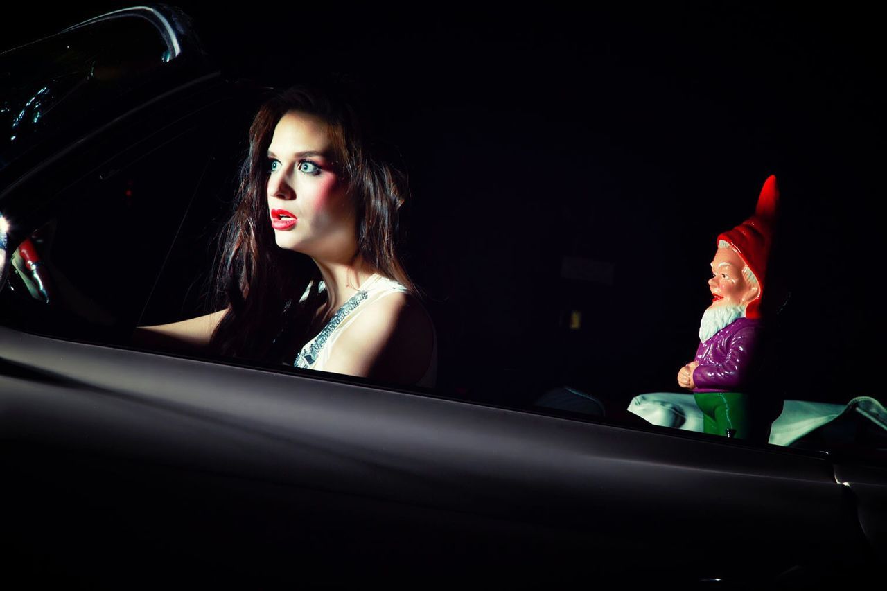 YOUNG WOMAN IN CAR