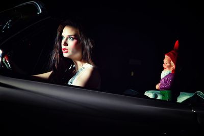 Beautiful young woman in car