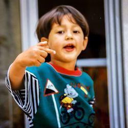 Portrait of cute boy holding 