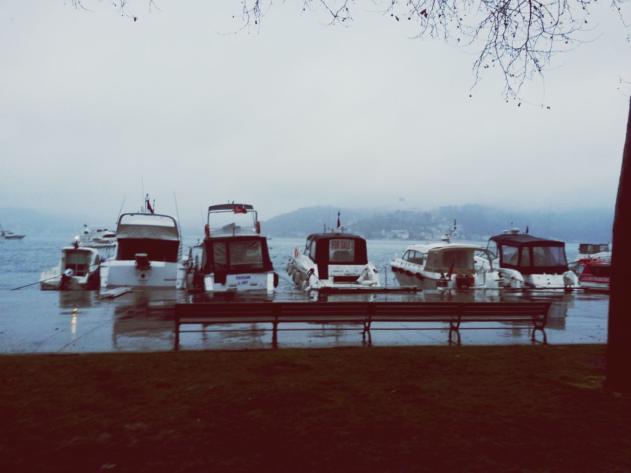 water, nautical vessel, moored, chair, boat, sea, sky, built structure, absence, empty, day, tranquility, architecture, nature, tranquil scene, transportation, mode of transport, table, lake, outdoors