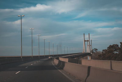 Bridge over highway against sky