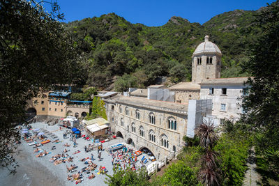 High angle view of trees and buildings against sky