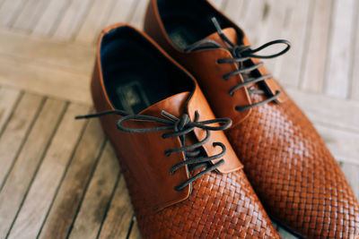 High angle view of shoes on wooden table