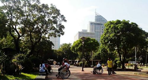 People walking on road in city