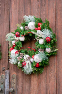 Directly above shot of flowers on wooden door