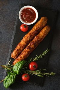 High angle view of vegetables on table against black background