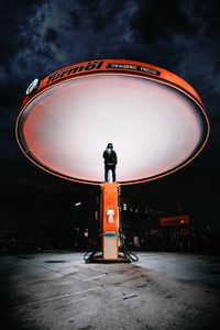 Close-up of basketball hoop against sky at night