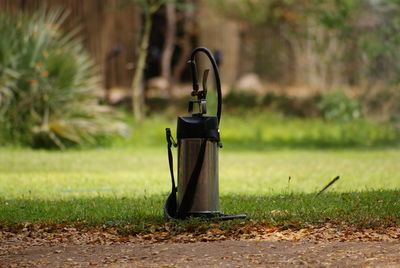 Close-up of faucet on field