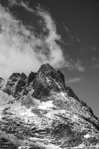 Low angle view of snowcapped mountain against sky