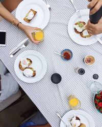 Directly above shot of people having food at table