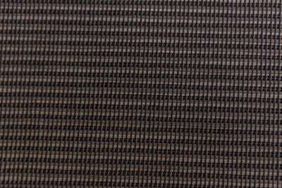 Full frame shot of metal grate against black background