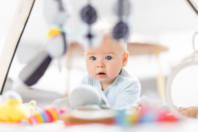 Portrait of cute boy playing with toy