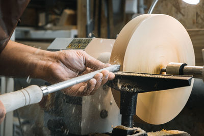 Close-up of man working in container