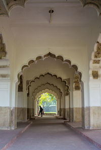 Rear view of people in corridor of building