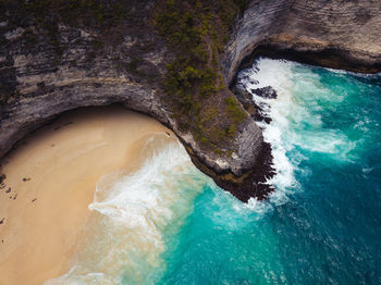 High angle view of water flowing through rocks