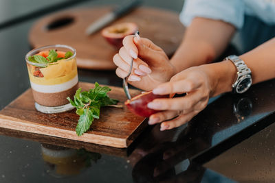 Midsection of man preparing food on table