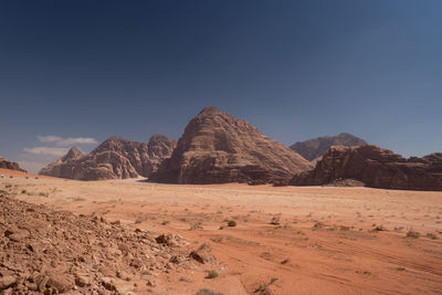 Scenic view of mountains against clear blue sky