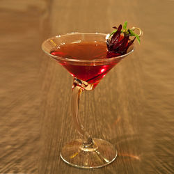 Close-up of red wine glass on table