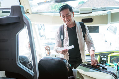 Portrait of young man working at airport