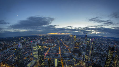 Aerial view of city lit up at night