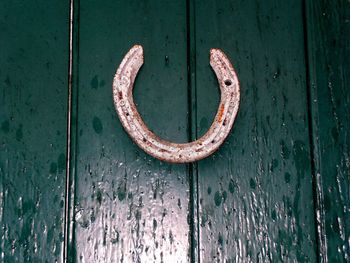 Close-up of horseshoe on door