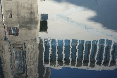 Reflection of buildings on beach