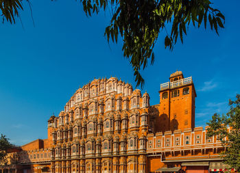 Low angle view of building against blue sky