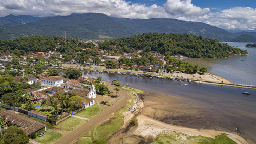 High angle view of townscape by sea