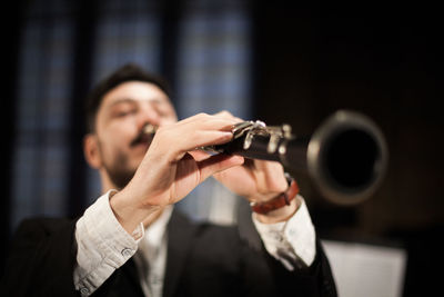 Portrait of man holding camera