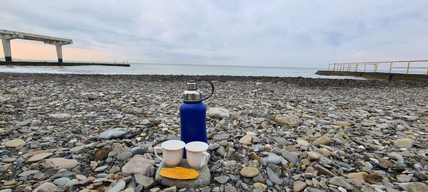 Lifeguard hut on beach against sky