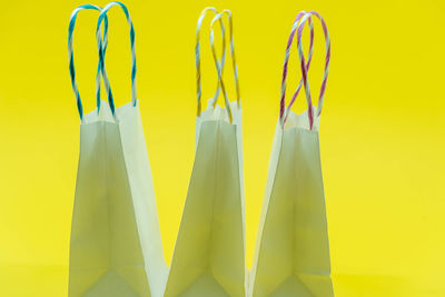 Close-up of fork over yellow background