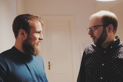 Two male friends indoors