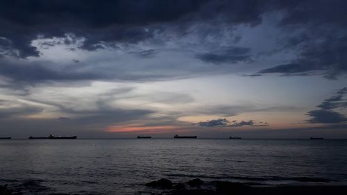 Scenic view of sea against sky at sunset