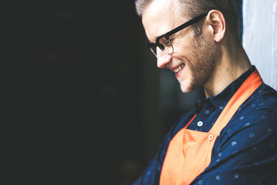 Smiling chef looking down