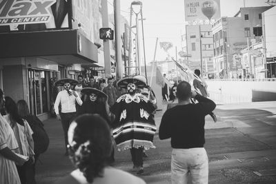 People photographing on street in city