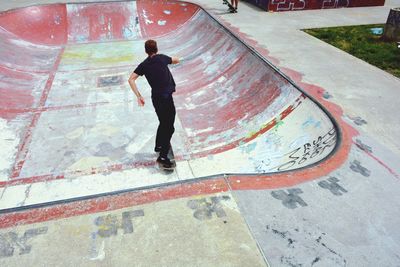 Man skateboarding on skateboard park