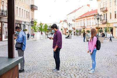 People walking on street in city